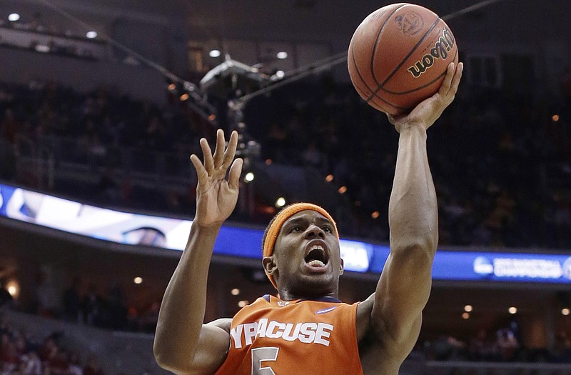 C.J. Fair of Syracuse shoots over a pair of Indiana defenders during Thursday night's win against the Hoosiers in Washington.