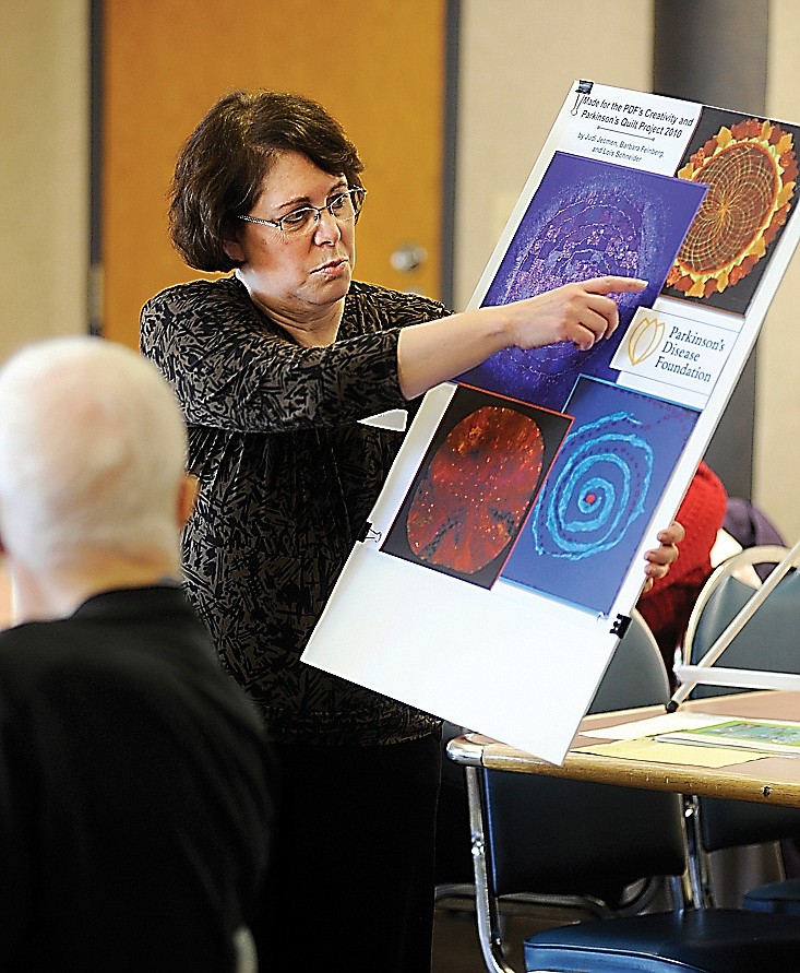 Judi Jecmen displays the quilt blocks she created for the Parkinson's Disease Foundation's Creativity and Parkinson's Quilt Project while speaking at a recent Jefferson City Parkinson's Support Group meeting at the Capital Region Medical Center.	