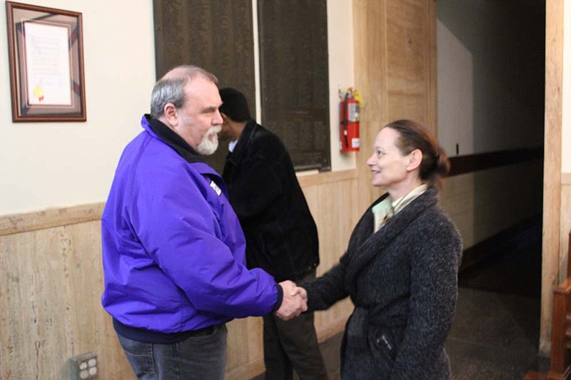 Kathy Segerson congratulates her opponent, Rick Shiverdecker, for successfully defending his Ward 4 seat on the Fulton City Council. Segerson, who lost last year's election by five votes and this year's by 33, vowed to run again.