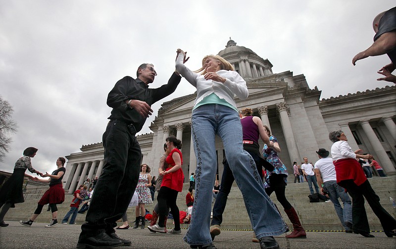 Ted Kelly, of Aberdeen, and Barb Robecker, of Lake Nahwatzel near Shelton, join over 100 fellow dancers Monday for a festive rally on the steps of the Capitol in Olympia, Wash. in support of SB5613 or the "Opportunity to Dance tax".