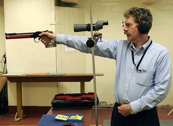Bruce Martindale takes aim as he competes in a weekly air gun league in Troy, N.Y. Martindale, who normally uses a .22-caliber, has cut back on practice because ammunition is in short supply. 