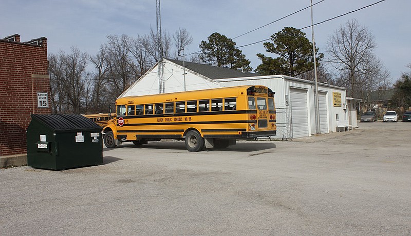 A Fulton Public Schools bus returns to the district bus yard after dropping off children from school in 2013. 