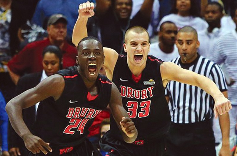 Drury forward Cameron Adams (24) and guard Alex Hall react as time expires in their 74-73 win against Metro State in the NCAA Division II national championship on Sunday in Atlanta.