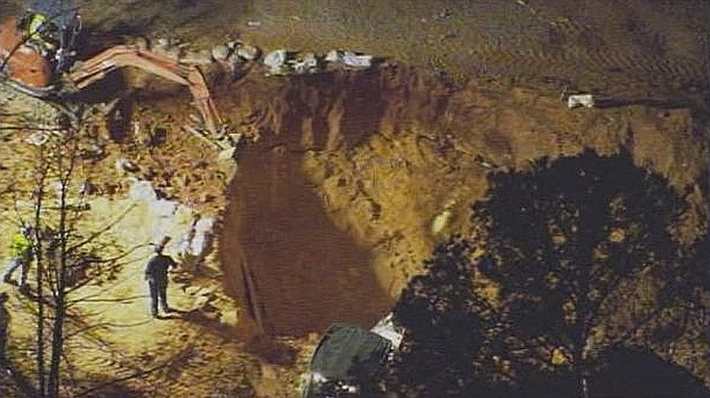 Authorities worked to rescue two children at a construction site Sunday, in Stanley, N.C. The two young cousins were recovered Monday from the collapsed rubble of a 24-foot deep pit that was being dug with a backhoe.