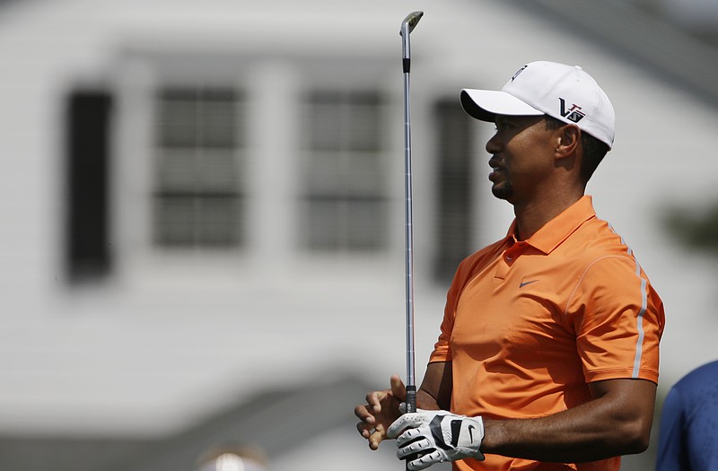 Tiger Woods watches his shot on the driving range Monday in Augusta, Ga.