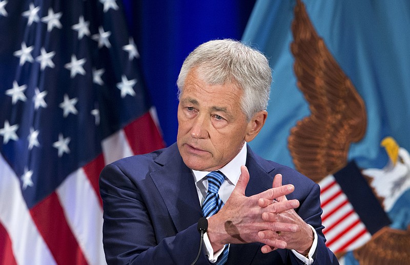 U.S. Defense Secretary Chuck Hagel said the greatest financial threat to the Pentagon isn't budget cuts but rather the "unchecked, spiraling costs" of new weapons and personnel benefits. He warned of sharply deeper cuts to personnel, health care and weapons systems across his department. 