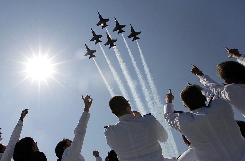 A formation of U.S. Navy Blue Angel fighter jets perform a flyover above graduating Midshipmen in May 2012 during the United States Naval Academy graduation and commissioning ceremonies in Annapolis, Md. The commander of Naval air forces announced Tuesday that the U.S. Navy has canceled the remainder of the elite Blue Angels demonstration team's 2013 season because of federal cuts.