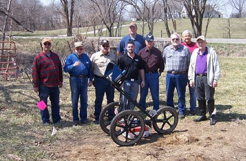 Sons of Confederate Veterans and other researchers pose with the sonar equipment used to pinpoint the location of the Moore's Mill mass grave site in Calwood. Front row, left to right: David Todd, Don Ernst, Kevin Wenzel, Peter Kessinger, Pablo Baum, Noel Crowson, Bill Connor, Wayne Sampson. Back: James Dixon.