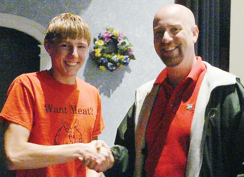 Co-Mo Representative John Agliata, right,  presents sophomore Allan Burger, son of Philip and Susan Burger with his certificate and $100 for winning C.Y.C.L.E. for this area.