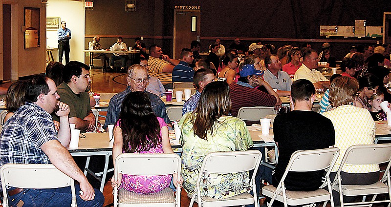 Attendees at the 37th annual Moniteau County Soil and Water Conservation District appreciation and awards banquet listen to the accomplishments of the district over the last year.