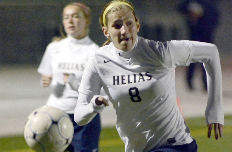 Morgan Rundle of the Helias Lady Crusaders attempts to chase down the ball on the offensive end of the field during Tuesday night's game against the Moberly Lady Spartans at the Falcon Athletic Complex in Wardsville.