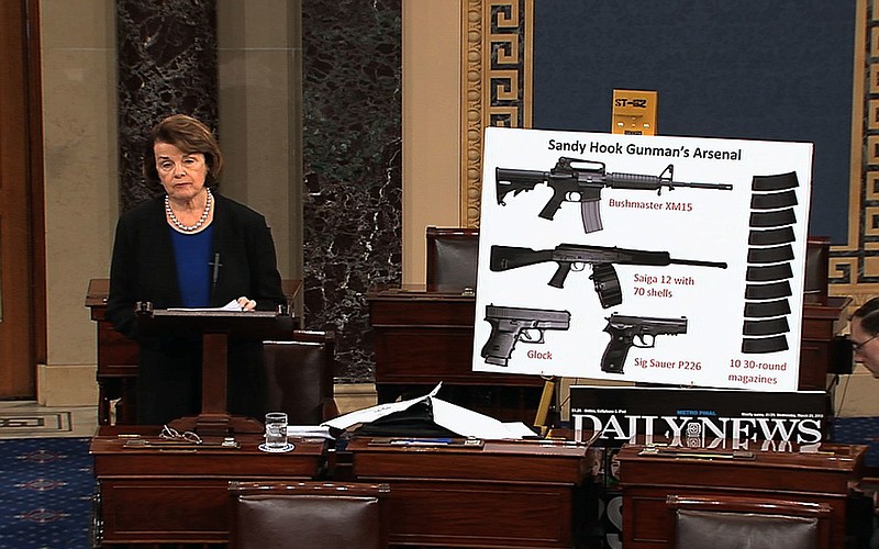 This video frame grab provided by Senate Television shows Sen. Dianne Feinstein, D-Calif., using a poster of weapons as she speaks Wednesday about gun legisalation on the floor of the Senate on Capitol Hill in Washington.