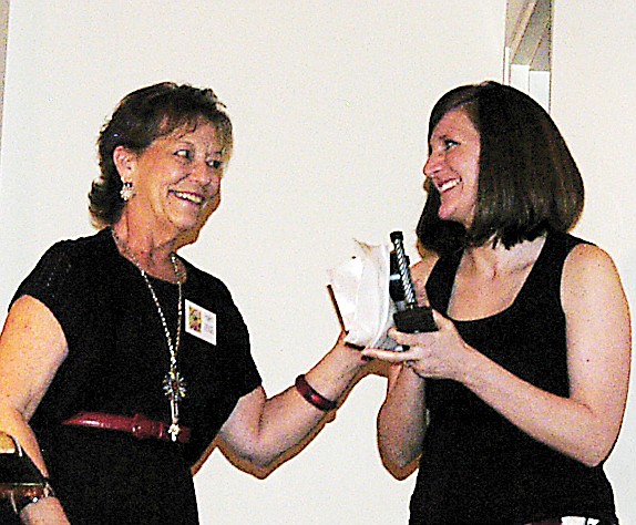 The SWCD 2012 Teacher of the Year Award is presented to Lindsey Porter, right, by Nancy Kirby, SWCD District Manager/Program Specialist II. Porter is a teacher at California Elementary School. 