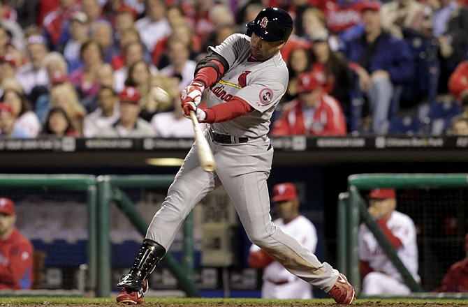 Carlos Beltran of the Cardinals belts a solo home run during the eighth inning of Thursday's game with the Phillies in Philadelphia.