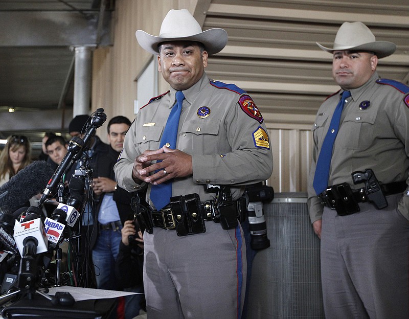 Texas Department of Public Safety Sgt. Jason Reyes, left, and Trooper Noey Fernandez inform reporters Friday that the death toll and the number of destroyed homes during a news conference in West, Texas. The bodies of 12 people have been recovered after an enormous Texas fertilizer plant explosion that demolished surrounding neighborhoods for blocks and left about 200 other people injured, authorities said.