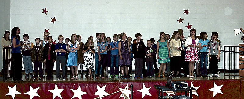 Democrat photo / David A. Wilson
Such a large number of students are recognized for scoring advanced or proficient on the MAP test for the 2011-2012 school year in the field of mathematics that they are brought on stage in two groups at the California Elementary School assembly on Friday, April 12.