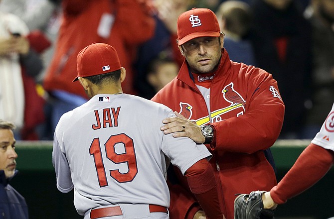 Cardinals center fielder  Jon Jay and manager Mike Matheny shake hands following Jay's diving catch to end the seventh inning Monday in Washington, D.C.