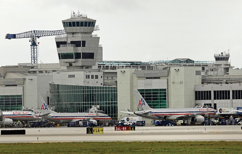 American Airlines passenger planes are parked at Miami International Airport in Miami. Sunday was the first day air traffic controllers were subject to furloughs resulting from government spending cuts.