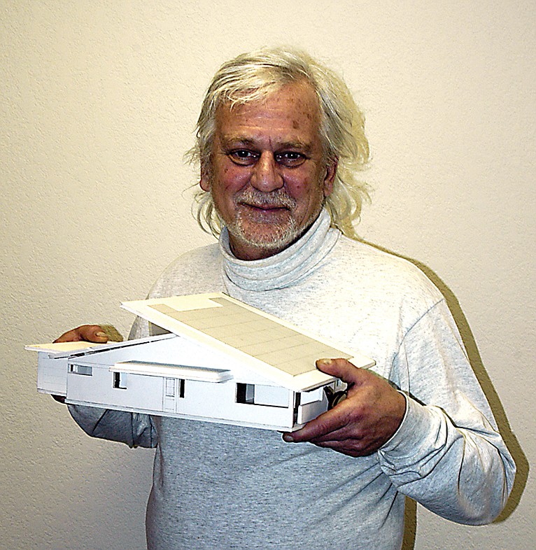 Architect Daniel Karlov, Jamestown, with a model of a "net zero" house which won a contest to be built in Columbia. 
