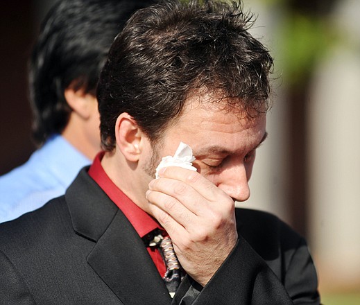 Paul Kevin Curtis, who had been in custody under suspicion of sending ricin-laced letters to President Barack Obama and others, wipes a tear from his eyes during a news conference following his release Tuesday.