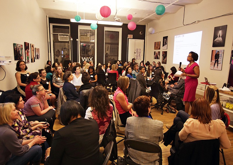 Group facilitator Franne McNeal, standing right, addresses women at a "Lean In" circle meeting in New York. The group is inspired by Facebook COO Sheryl Sandberg's book "Lean In," which seeks to empower women in the workplace.