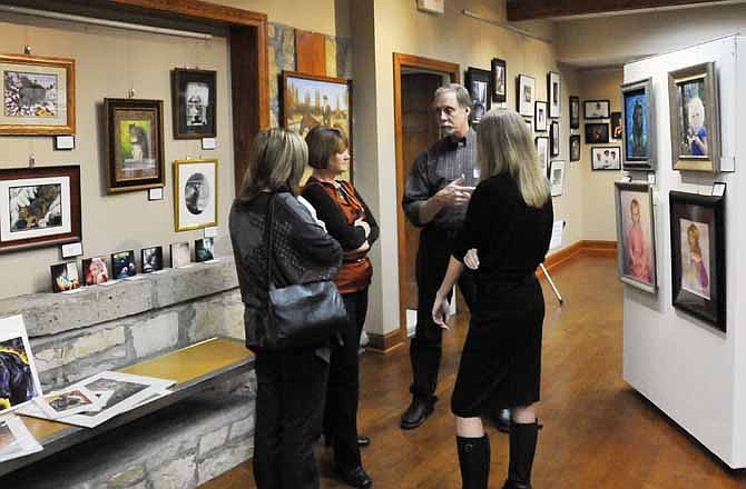 In this News Tribune file photo, patrons meet artists at Capital Arts during the 2012 Art Exposed Jefferson City Gallery Crawl.