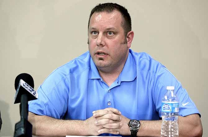 Former Gresham, Ore., police officer Jason Servo speaks at his attorney's office in Portland, Ore., Friday, April 26, 2013. Servo, fired for driving drunk in an unmarked police car while off-duty in January, 2011, has filed a $6 million lawsuit against the city, the police chief and others, alleging his rights were violated under the Americans with Disabilities Act.