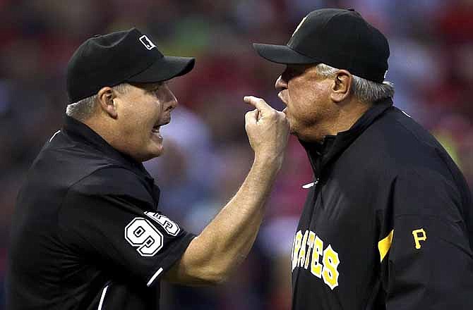 Home plate umpire Tim Timmons, left, and Pittsburgh Pirates manager Clint Hurdle yell at each other after Timmons threw Hurdle out of a baseball game during the first inning against the St. Louis Cardinals Friday, April 26, 2013, in St. Louis.