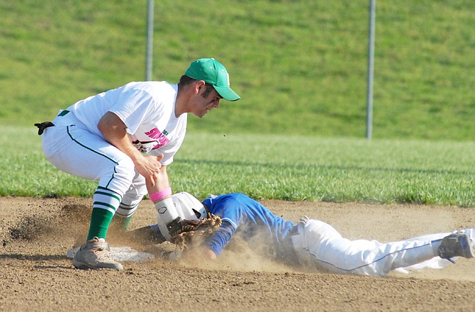 Hayden Haney of Blair Oaks tags out Austin Hulbert of Boonville at second base during Tuesday's game in Wardsville.