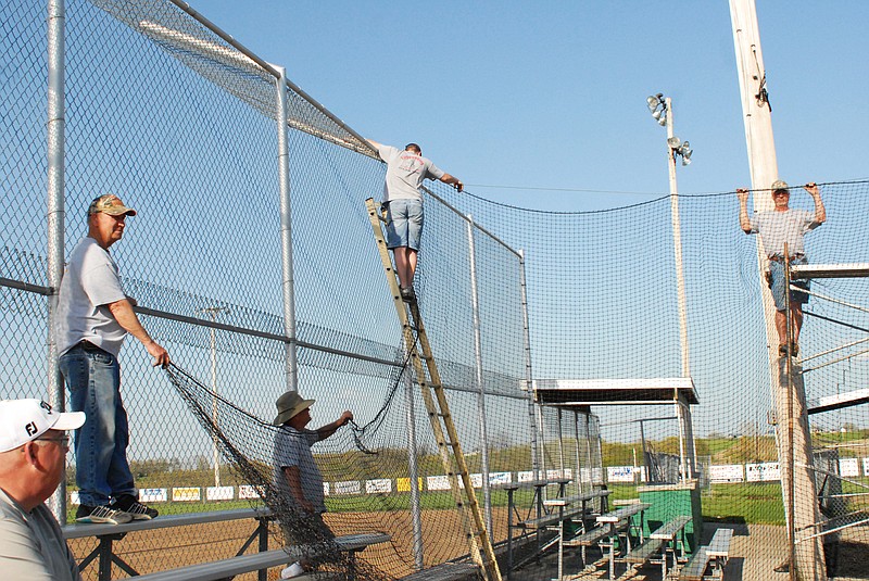 Volunteers at the Lions Field in Wardsville put up protective nets over the bleachers Monday evening. Two of the country's top Lions Clubs are located right here in Central Missouri, the Wardsville club and the Westphalia club. 