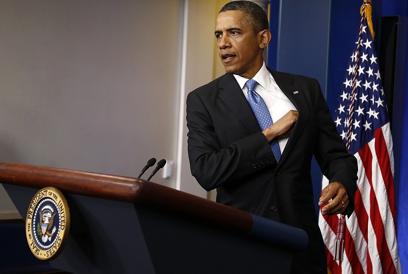 President Barack Obama arrives Tuesday for a news conference in the Brady Press Briefing Room of the White House in Washington.