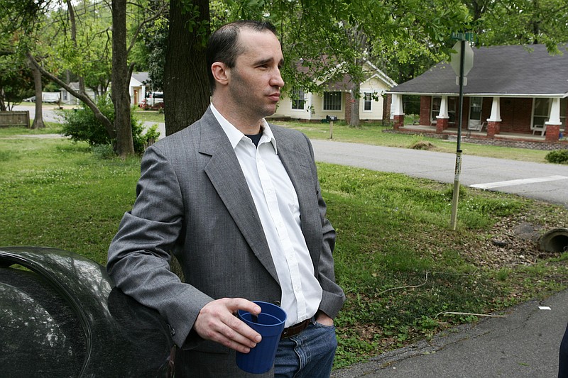 Everett Dutschke stands in the street near his home Tuesday in Tupelo, Miss., and waits for the FBI to arrive and search his home. Ricin has been found in a business once used by Dutschke, who was charged in the case of letters laced with the deadly poison being sent to President Barack Obama, according to a court document made public.