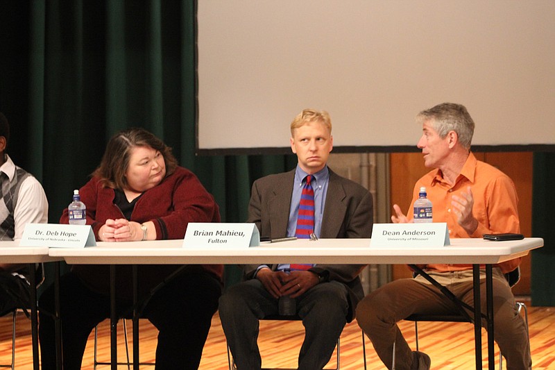 Deb Hope, Brian Mahiue and Dean Andersen prepare to answer questions from the crowd as part of the panel discussion for the Cultural Competence Council's second-annual LGBT-themed Community Conversation Thursday, hosted at the Missouri School for the Deaf.