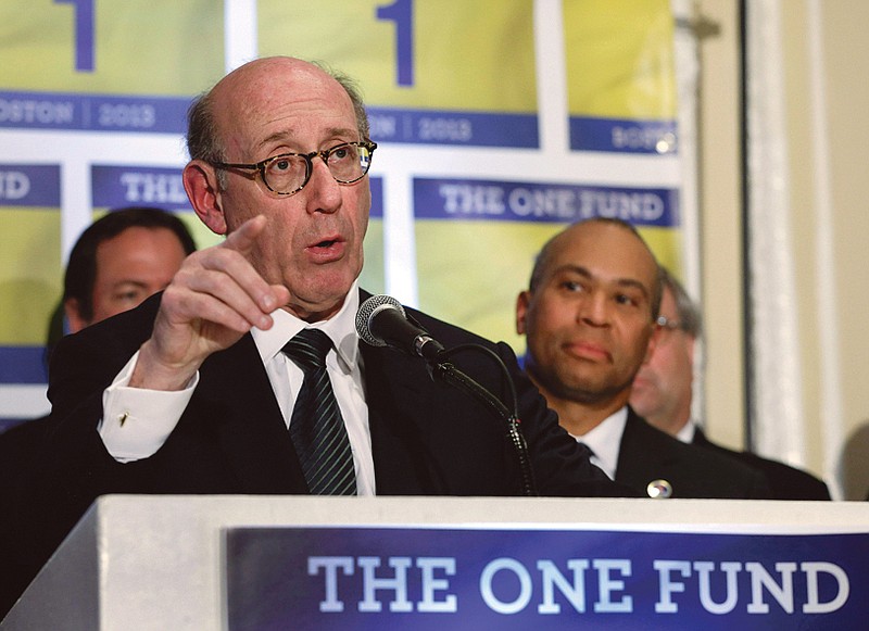 Kenneth Feinberg, an attorney who managed the 9/11 Victim Compensation Fund, speaks at a news conference in Boston as Massachusetts Gov. Deval Patrick, right, listens. The One Fund was established as a central place to gather donations for the Boston Marathon bombing victims.