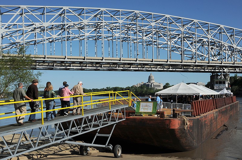 Guests make their way up the gang plank for the Jefferson City Convention and Visitors' Bureau second annual "Barge into History" tour in 2012.
