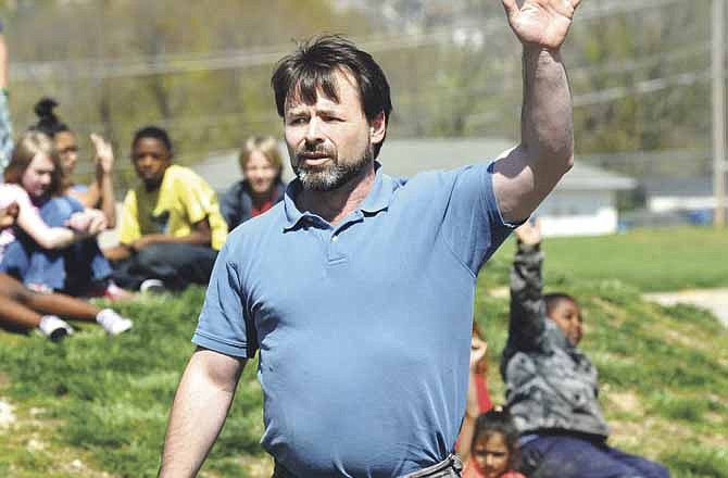 Nick Kuhn talks to students at Thorpe Gordon Elementary School in Jefferson City during a recent tree planting ceremony. Kuhn is forestry coordinator for the Missouri Department of Conservation.