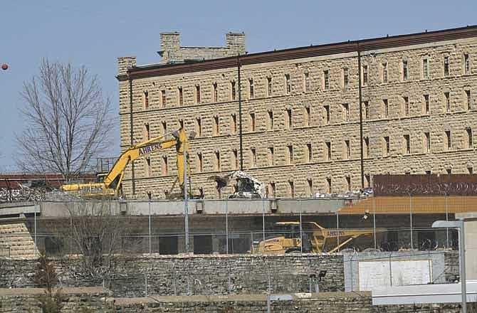 In this News Tribune file photo from March 2012, work begins on demolishing the school, library and chapel buildings between A-Hall and McClung Hall on the old Missouri State Penitentiary site.