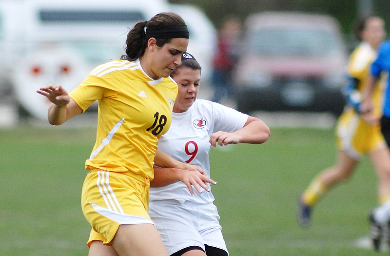 Jefferson City senior Cassie Jobe (9) fights with Kickapoo's Natalie Closser to keep control of the ball during Monday's game at the 179 Soccer Park.