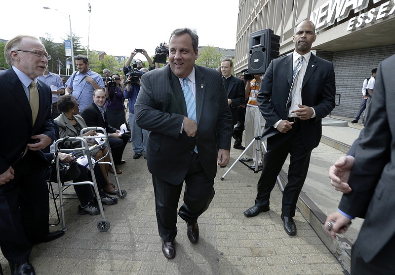 New Jersey Gov. Chris Christie walks to a podium Tuesday during the groundbreaking ceremony for the Technology Enhanced Accelerated Learning Center at Essex County Newark Tech in Newark, N.J. Reports say Christie secretly underwent a weight-loss surgery in February, when a band was placed around his stomach to restrict the amount of food he can eat.