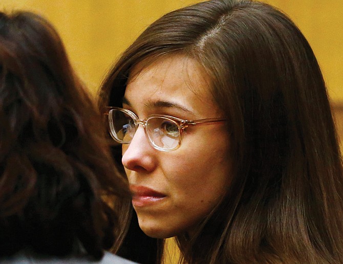 Jodi Arias reacts as she is declared guilty of first-degree murder in the death of her boyfriend, Travis Alexander.
