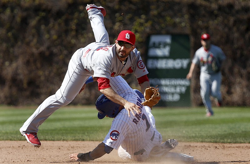 Cardinals second baseman Daniel Descalso turns a double play as the Cubs' Cody Ransom slides into second base during Wednesday's game at Wrigley Field in Chicago.