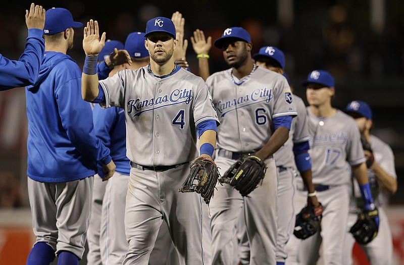 Royals left fielder Alex Gordon (4) high-fives teammates after Thursday night's 6-2 victory against the Orioles in Baltimore.