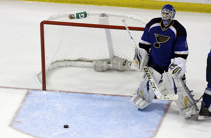 Blues goalie Brian Elliott stands near the net after giving up a goal in overtime Wednesday night to Slava Voynov of the Kings in Game 5 of their playoff series in St. Louis.
