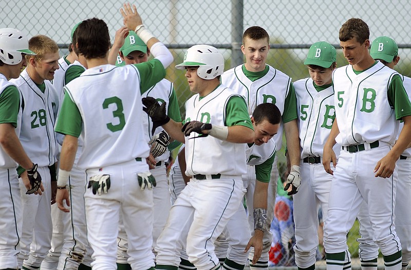 Blair Oaks players greet teammate Hayden Haney (center) after he blasted a two-run home run in Wednesday's game against North Callaway in Wardsville. Haney and the Falcons are scheduled to open district play Saturday against the Versailles Tigers at the Falcon Athletic Complex.