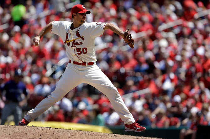 St. Louis Cardinals starting pitcher Adam Wainwright throws during the fourth inning of a baseball game against the Colorado Rockies Saturday, May 11, 2013, in St. Louis. 