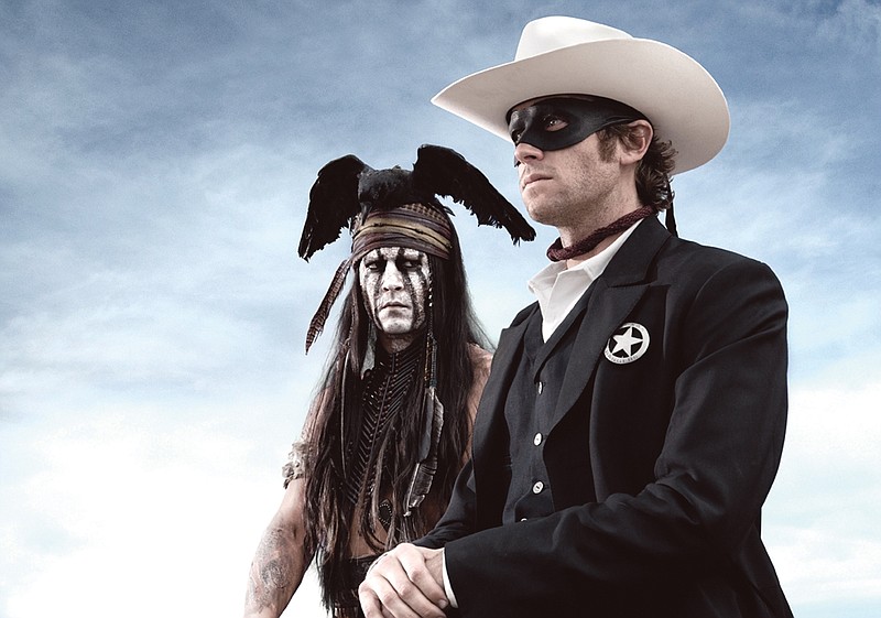 An undated publicity photo shows actors, Johnny Depp, left, as Tonto, a spirit warrior on a personal quest, who joins forces in a fight for justice with Armie Hammer, as John Reid, a lawman who has become a masked avenger in the film, "The Lone Ranger." 