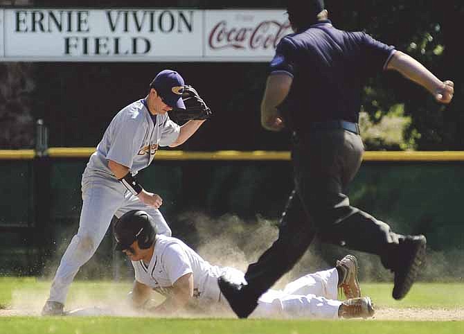Hayden Strobel of the Jays slides into second under the tag of Camdenton shortstop Tristan Starkey after advancing following an errant throw to first on a ground ball in the second inning of Saturday's Class 5 District 9 tournament matchup in Jefferson City.