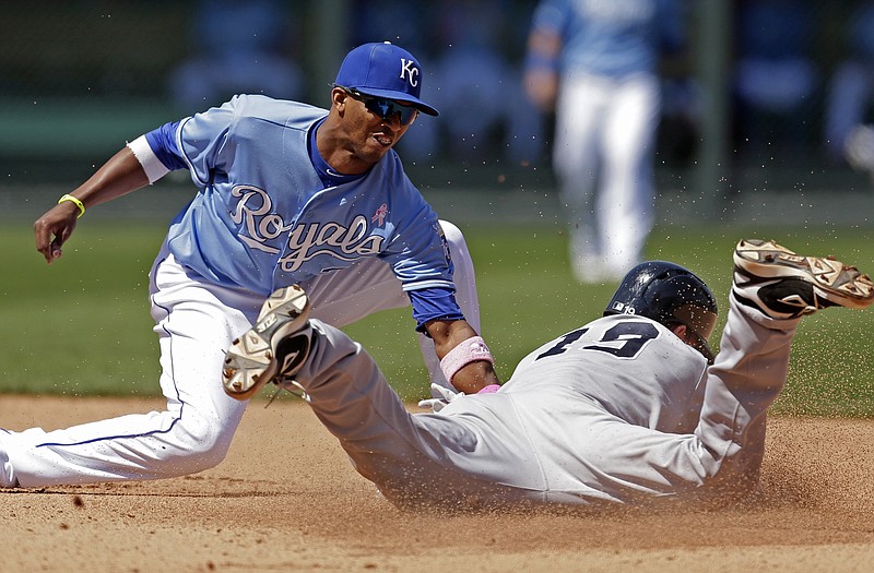 The Yankees' Chris Stewart is caught stealing second by Royals shortstop Alcides Escobar during the seventh inning of Sunday's game at Kauffman Stadium in Kansas City.