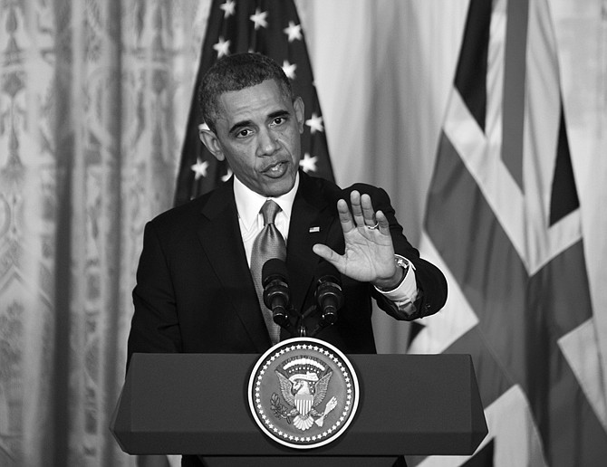 During a joint news conference with visiting British Prime Minister David Cameron, an agitatted President Barack Obama defends his administration's actions after the wake of the attacks on the U.S. consulate in Benghazi, Libya, last year. On reports that Internal Revenue Service targeted conservative groups, Obama said it was "outrageous" and anyone involved needs to be "held fully accountable." 