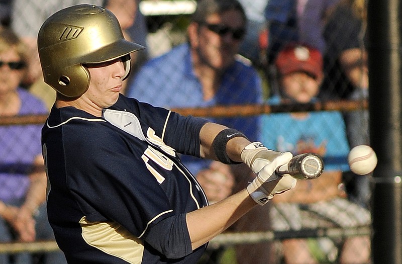 Todd Buschjost of Helias takes a swing during Class 5 District 9 semifinal game against Camdenton at Vivion Field.